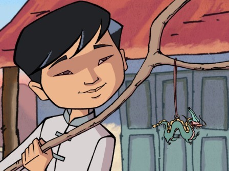 Wang joue avec un bâton en bois auquel est accroché un petit dragon en papier